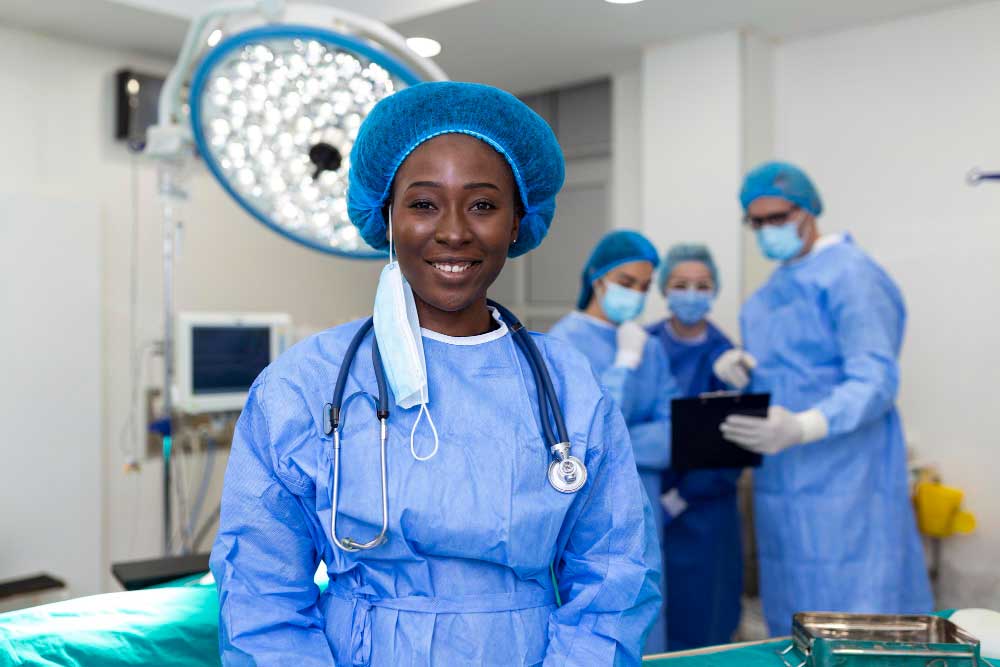 portrait-happy-african-american-woman-surgeon-standing-operating-room-ready-work-patient-female-medical-worker-surgical-uniform-operation-theateweb